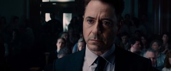 Movie still from “The Judge” (2014), directed by David Dobkin – A person wearing a suit and tie; Close Up shot, Over the shoulder angle