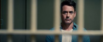 Movie still from “The Judge” (2014), directed by David Dobkin – A person behind a fence; Close Up shot, Over the shoulder angle