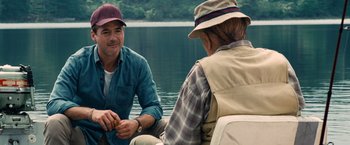 Movie still from “The Judge” (2014), directed by David Dobkin – A man and a woman sitting on a boat in the water; Medium shot, Over the shoulder angle