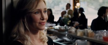 Movie still from “The Judge” (2014), directed by David Dobkin – A person sitting at a table in front of other people; Close Up shot, Over the shoulder angle