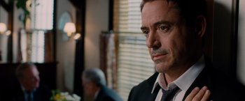 Movie still from “The Judge” (2014), directed by David Dobkin – A person wearing a suit and tie; Close Up shot, Over the shoulder angle