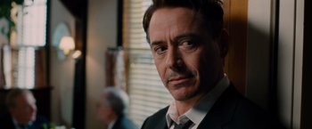 Movie still from “The Judge” (2014), directed by David Dobkin – A person wearing a suit and tie; Close Up shot, Over the shoulder angle