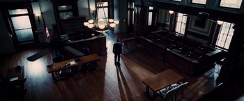 Movie still from “The Judge” (2014), directed by David Dobkin – A man standing in a room with a lot of furniture; Extreme Wide shot, High angle