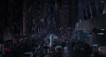 Movie still from “Batman” (1989), directed by Tim Burton – A city street filled with lots of traffic at night; Extreme Wide shot, High angle