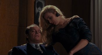 Movie still from “Batman” (1989), directed by Tim Burton – A man and a woman in a dark room; Medium shot, Low angle