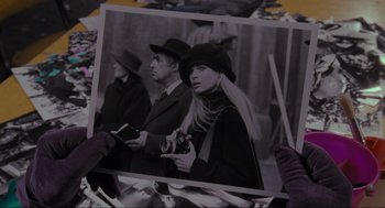Movie still from “Batman” (1989), directed by Tim Burton – A black and white photo of a man and a woman holding a camera; Close Up shot, Over the shoulder angle