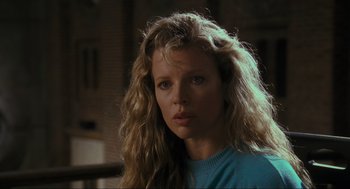 Movie still from “Batman” (1989), directed by Tim Burton – A person with long blonde hair; Close Up shot, Low angle