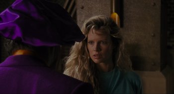Movie still from “Batman” (1989), directed by Tim Burton – A woman with long blonde hair looking at a mirror; Close Up shot, Over the shoulder angle