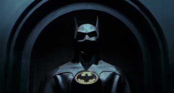 Movie still from “Batman” (1989), directed by Tim Burton – A batman mask in a dark room; Medium shot, Low angle