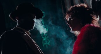 Movie still from “Batman” (1989), directed by Tim Burton – A man and a woman standing next to each other; Close Up shot, Over the shoulder angle