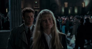 Movie still from “Batman” (1989), directed by Tim Burton – A man and a woman standing next to each other; Medium shot, Over the shoulder angle