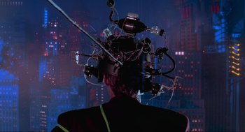 Movie still from “Batman Forever” (1995), directed by Joel Schumacher – A man with a lot of wires attached to his head; Close Up shot, Over the shoulder angle