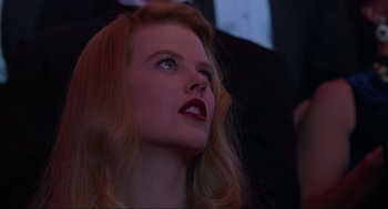 Movie still from “Batman Forever” (1995), directed by Joel Schumacher – A person with red lipstick; Close Up shot, Low angle