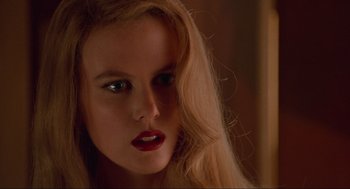 Movie still from “Batman Forever” (1995), directed by Joel Schumacher – A person with long hair; Close Up shot, Low angle