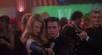 Movie still from “Batman Forever” (1995), directed by Joel Schumacher – A man and a woman are dancing in a ballroom; Medium shot, Low angle