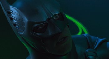 Movie still from “Batman Forever” (1995), directed by Joel Schumacher – A person wearing a batman mask; Close Up shot, Low angle