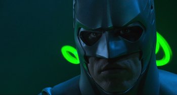 Movie still from “Batman Forever” (1995), directed by Joel Schumacher – A man wearing a batman mask; Close Up shot, Low angle