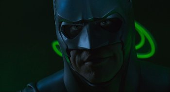 Movie still from “Batman Forever” (1995), directed by Joel Schumacher – A person wearing a batman mask; Close Up shot, Low angle