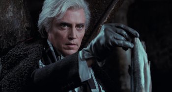 Movie still from “Batman Returns” (1992), directed by Tim Burton – A person wearing gloves; Close Up shot, Low angle