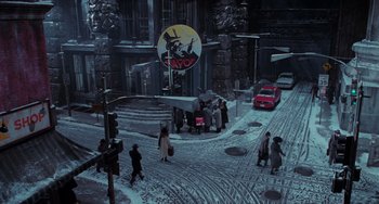 Movie still from “Batman Returns” (1992), directed by Tim Burton – A group of people walking on a snowy sidewalk; Extreme Wide shot, High angle