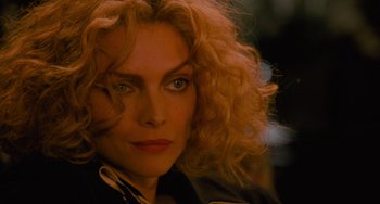 Movie still from “Batman Returns” (1992), directed by Tim Burton – A person with curly red hair; Close Up shot, Over the shoulder angle