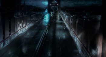 Movie still from “Batman Returns” (1992), directed by Tim Burton – An empty street at night in the dark; Extreme Wide shot, High angle