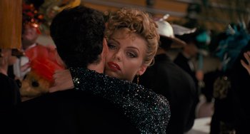 Movie still from “Batman Returns” (1992), directed by Tim Burton – A man and a woman embracing each other; Close Up shot, Over the shoulder angle