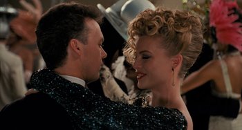 Movie still from “Batman Returns” (1992), directed by Tim Burton – A man and a woman are dancing together; Close Up shot, Over the shoulder angle