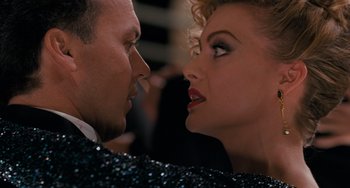 Movie still from “Batman Returns” (1992), directed by Tim Burton – A man and a woman face to face in front of a crowd; Close Up shot, Over the shoulder angle