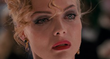 Movie still from “Batman Returns” (1992), directed by Tim Burton – A woman's eyes and face; Close Up shot, High angle