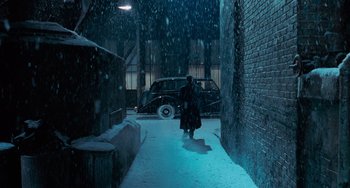 Movie still from “Batman Returns” (1992), directed by Tim Burton – A person walking down a street in the snow; Extreme Wide shot, High angle
