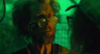 Movie still from “Batman & Robin” (1997), directed by Joel Schumacher – A man with a beard and glasses is looking at another man; Close Up shot, Over the shoulder angle