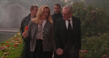 Movie still from “Batman & Robin” (1997), directed by Joel Schumacher – A man and a woman holding hands while standing next to each other; Medium shot, Over the shoulder angle