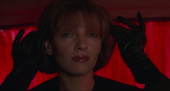 Movie still from “Batman & Robin” (1997), directed by Joel Schumacher – A person wearing a black shirt; Close Up shot, Low angle