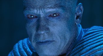 Movie still from “Batman & Robin” (1997), directed by Joel Schumacher – An image of a man that is looking at the camera; Close Up shot, Low angle