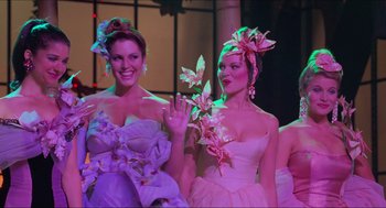 Movie still from “Batman & Robin” (1997), directed by Joel Schumacher – Two beautiful women dressed up in fancy dresses; Medium shot, Over the shoulder angle