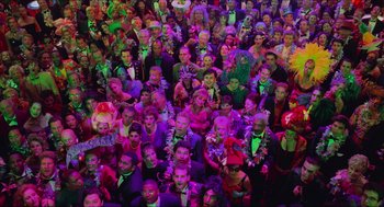 Movie still from “Batman & Robin” (1997), directed by Joel Schumacher – A large group of people in a room with neon lights; Extreme Wide shot, High angle
