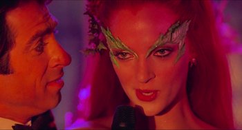 Movie still from “Batman & Robin” (1997), directed by Joel Schumacher – A person with makeup on their face; Close Up shot, Over the shoulder angle