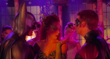 Movie still from “Batman & Robin” (1997), directed by Joel Schumacher – A group of young people dressed up in costumes; Medium shot, Over the shoulder angle