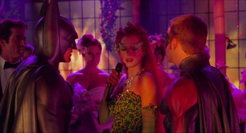 Movie still from “Batman & Robin” (1997), directed by Joel Schumacher – A group of people dressed as batman and robin; Medium shot, Over the shoulder angle