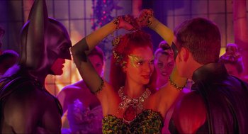 Movie still from “Batman & Robin” (1997), directed by Joel Schumacher – A group of young people in costume at a party; Medium shot, Over the shoulder angle