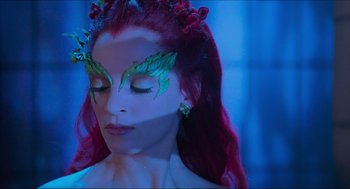 Movie still from “Batman & Robin” (1997), directed by Joel Schumacher – A person with makeup on; Close Up shot, High angle