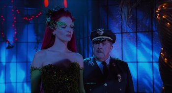 Movie still from “Batman & Robin” (1997), directed by Joel Schumacher – A man and a woman dressed up in costumes; Medium shot, Over the shoulder angle