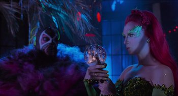 Movie still from “Batman & Robin” (1997), directed by Joel Schumacher – A woman holding a crystal ball in front of a man; Medium shot, Over the shoulder angle
