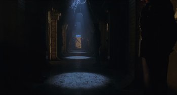 Movie still from “Batman & Robin” (1997), directed by Joel Schumacher – A dark hallway with a light shining on it; Extreme Wide shot, Low angle