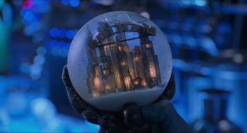 Movie still from “Batman & Robin” (1997), directed by Joel Schumacher – A hand holding a snow globe with a city in it; Extreme Close Up shot, Low angle