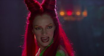Movie still from “Batman & Robin” (1997), directed by Joel Schumacher – A person with long red hair; Close Up shot, Over the shoulder angle