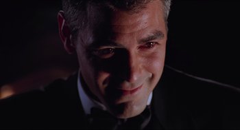 Movie still from “Batman & Robin” (1997), directed by Joel Schumacher – A person wearing a suit and tie; Close Up shot, Low angle