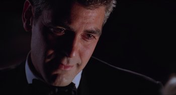 Movie still from “Batman & Robin” (1997), directed by Joel Schumacher – A person wearing a suit and tie; Close Up shot, Low angle