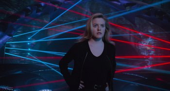 Movie still from “Batman & Robin” (1997), directed by Joel Schumacher – A woman standing in front of a wall of lights; Medium shot, Low angle